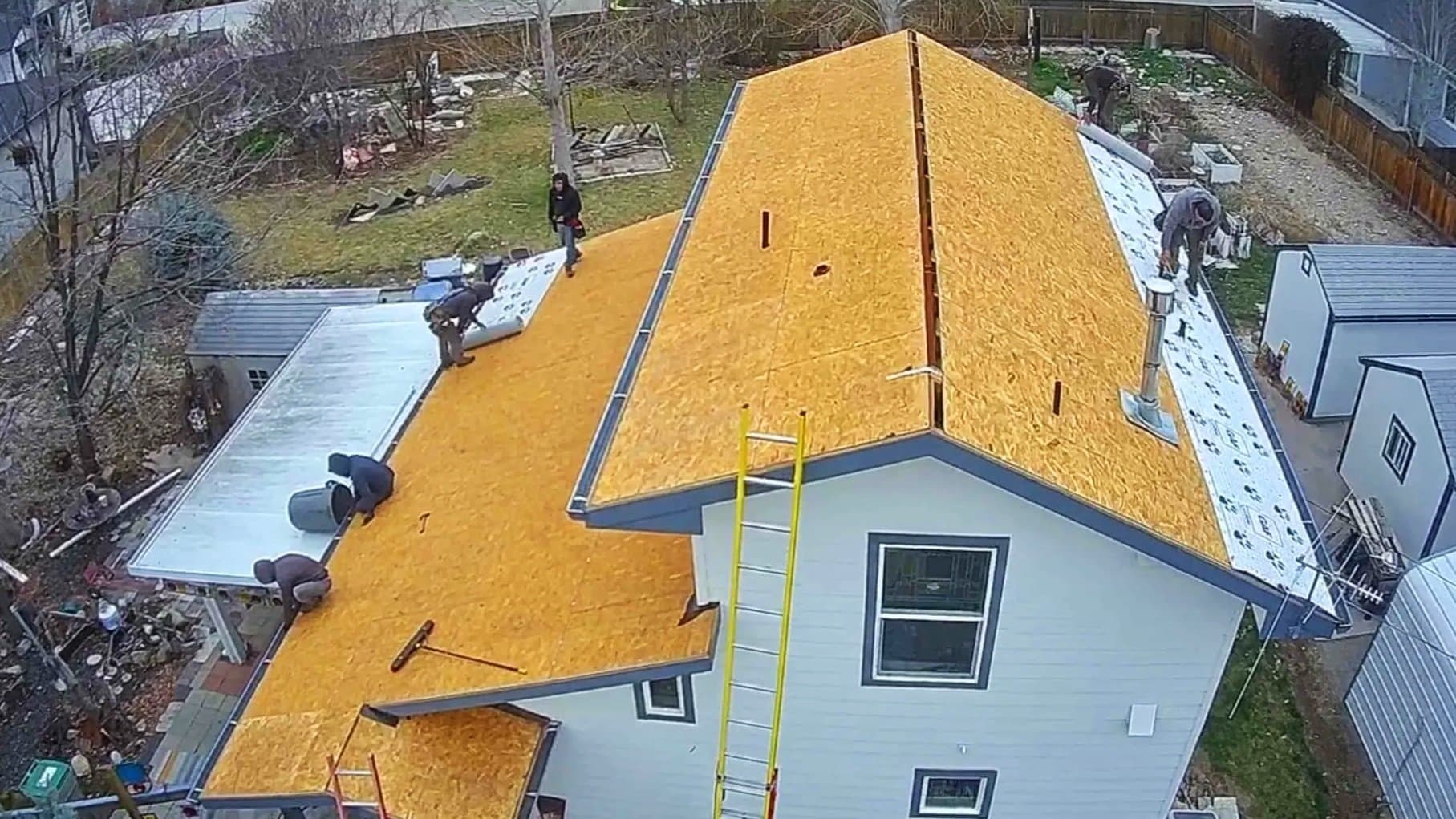 Professional roof repair work on a residential home